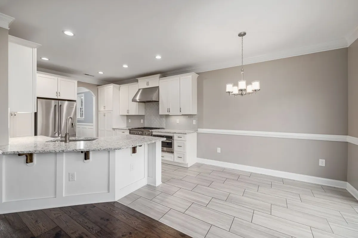 White painted kitchen cabinets with a smooth professional finish