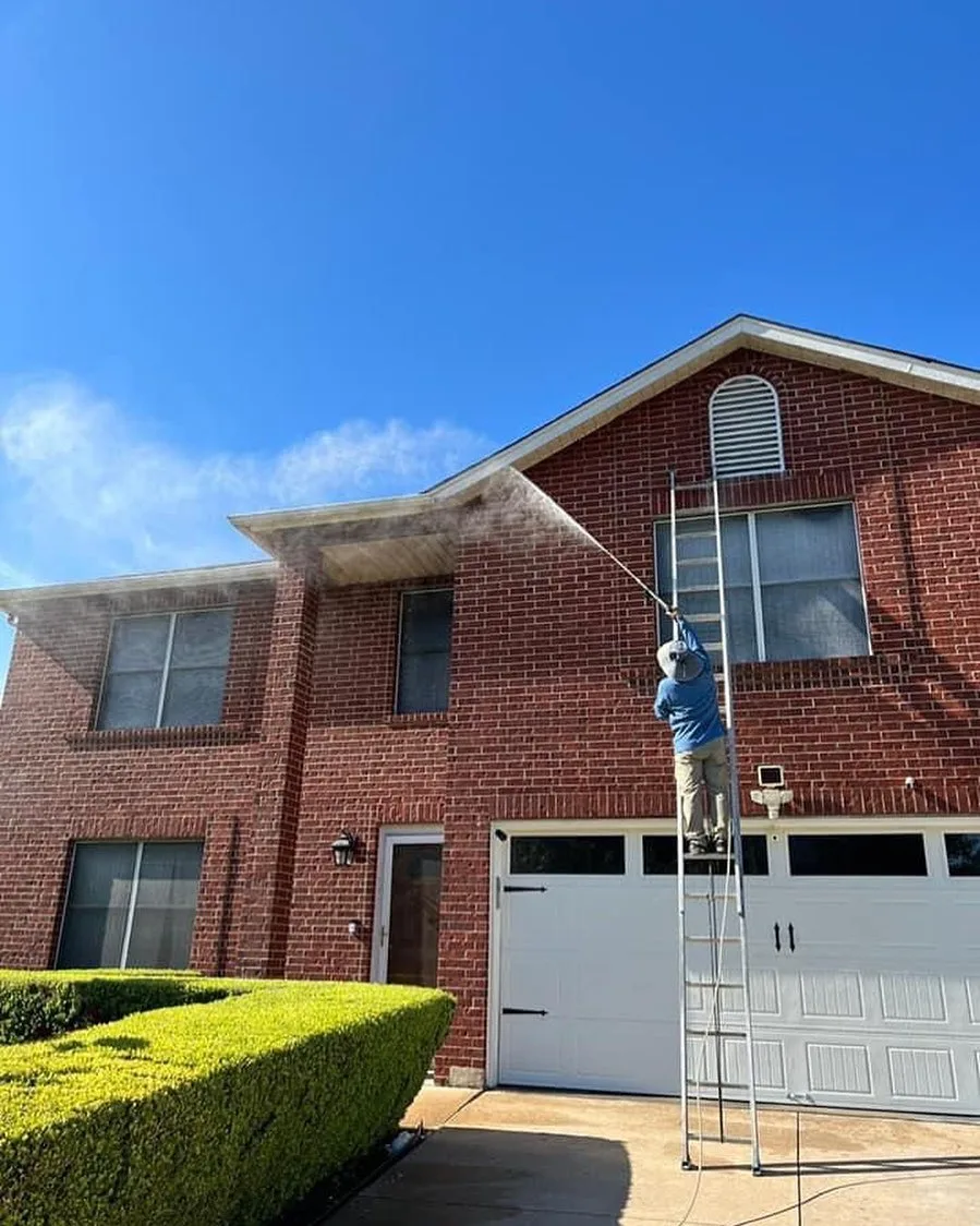 New Life Painting preparing a red brick home exterior in the Austin area