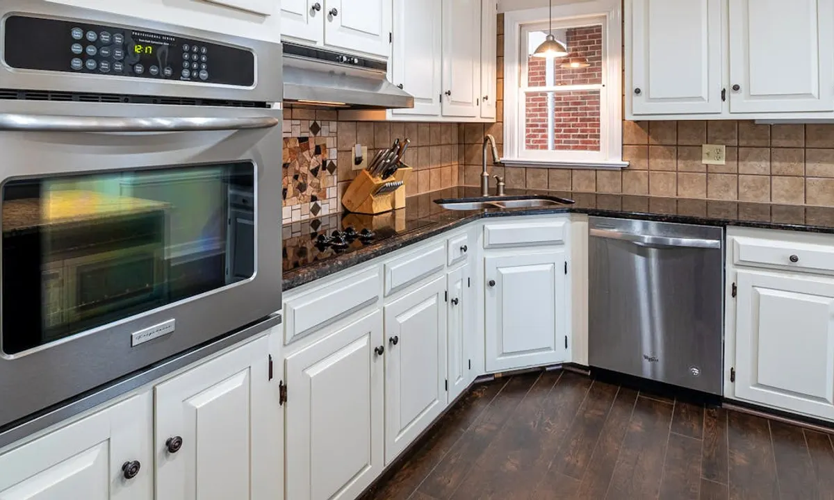 Finished kitchen cabinets in a modern kitchen after a cabinet painting project
