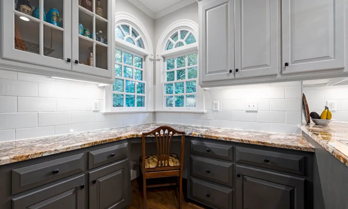 Two-tone kitchen cabinets showing a cabinet finish update