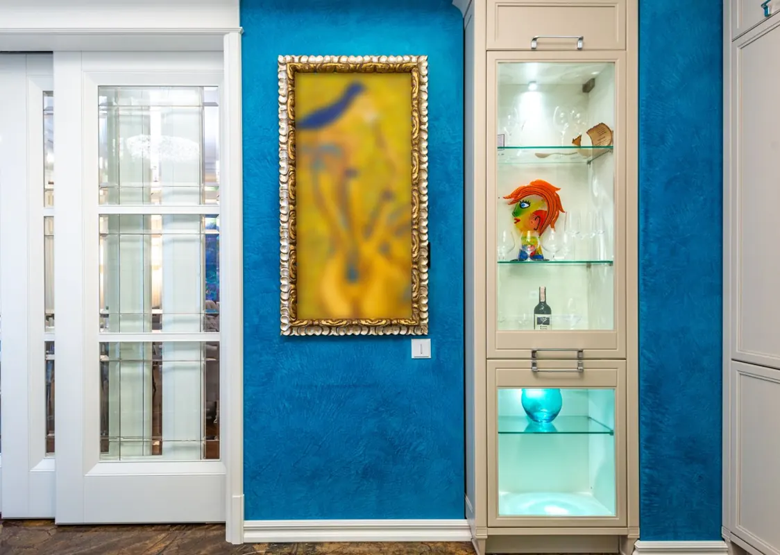 Contemporary room with a blue wall showing how interior paint colors change a space
