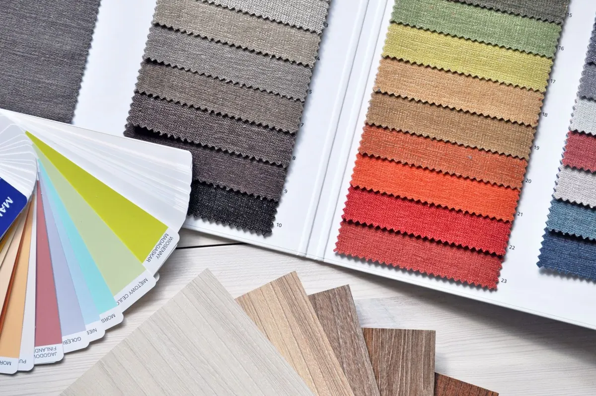 Paint and fabric material samples for choosing an Austin home color palette