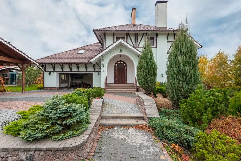 Finished painted home exterior with landscaped curb appeal