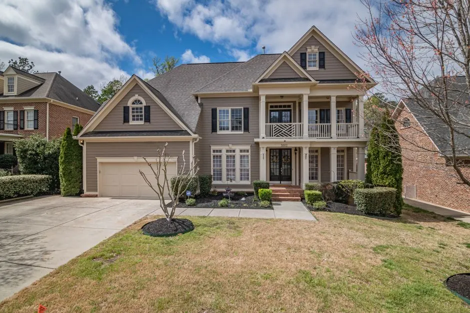 Large luxury home exterior with fresh neutral paint