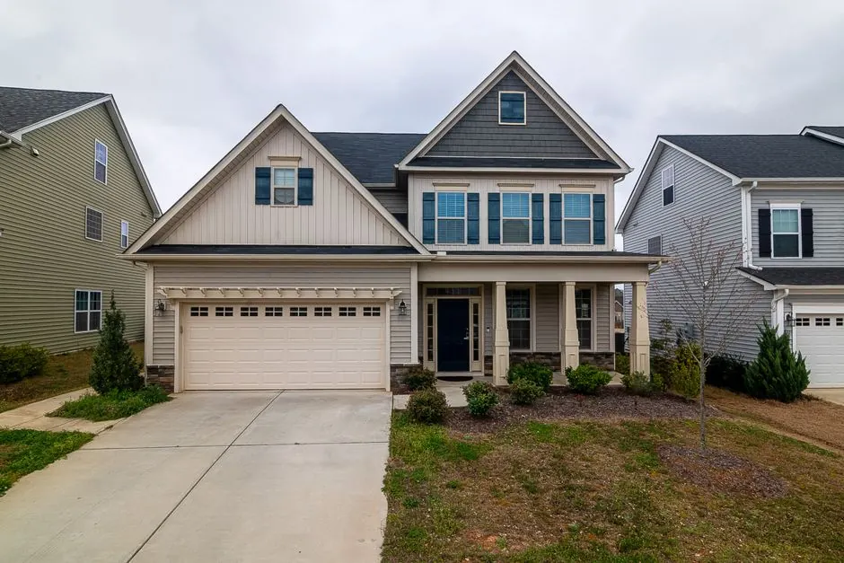 Neutral home exterior showing fresh paint and trim in a neighborhood