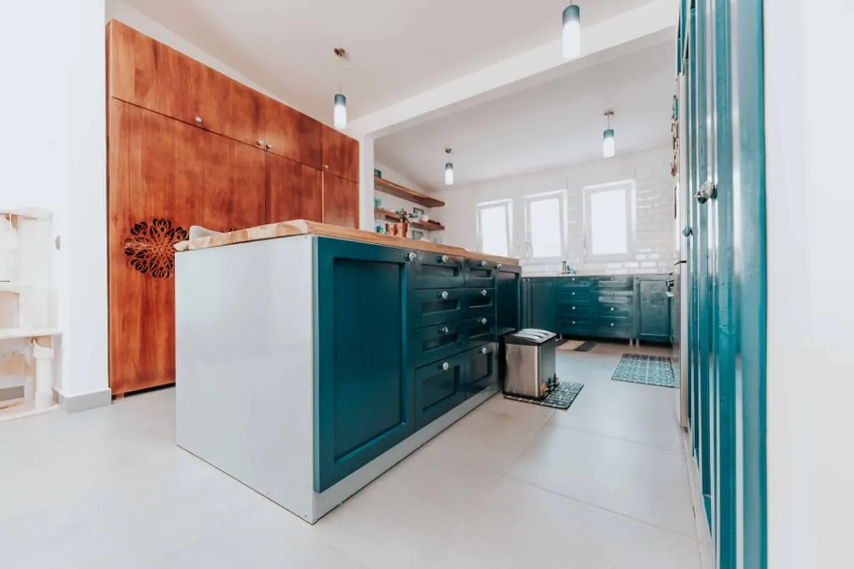 Blue painted kitchen cabinets showing a durable cabinet finish