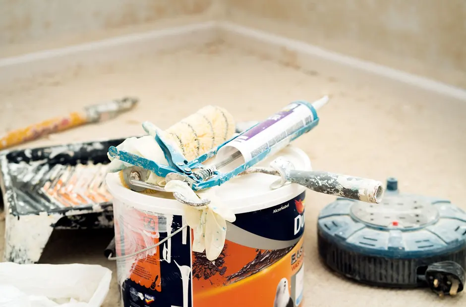 Paint roller detail showing a fresh coat of paint on an interior wall