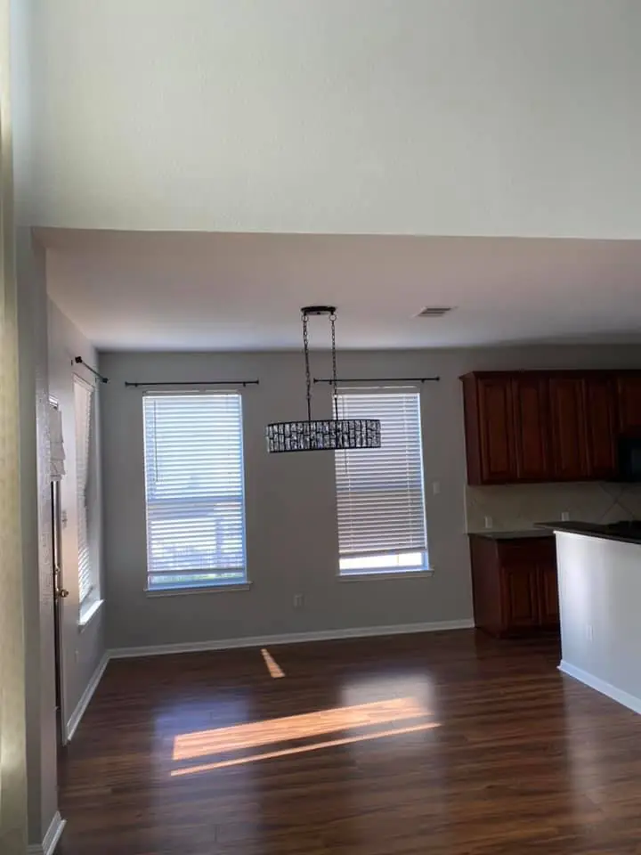Bright finished kitchen and living room interior painting project by New Life Painting