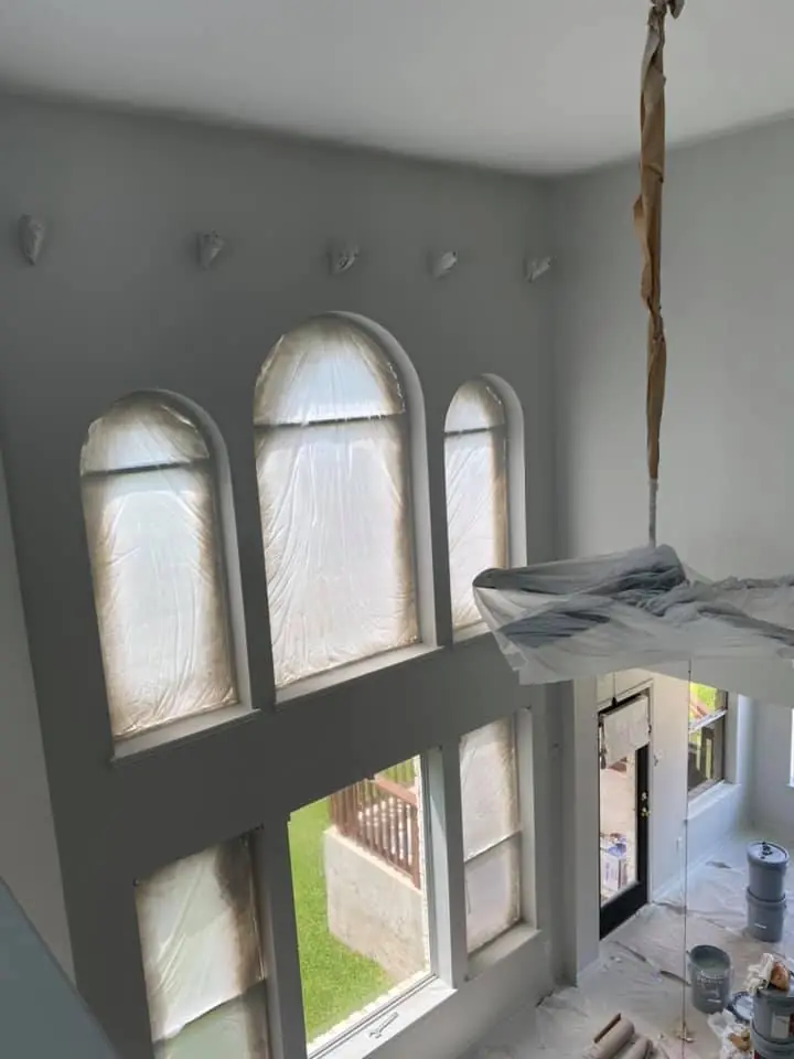 Interior painting prep work with protected windows and clean masking