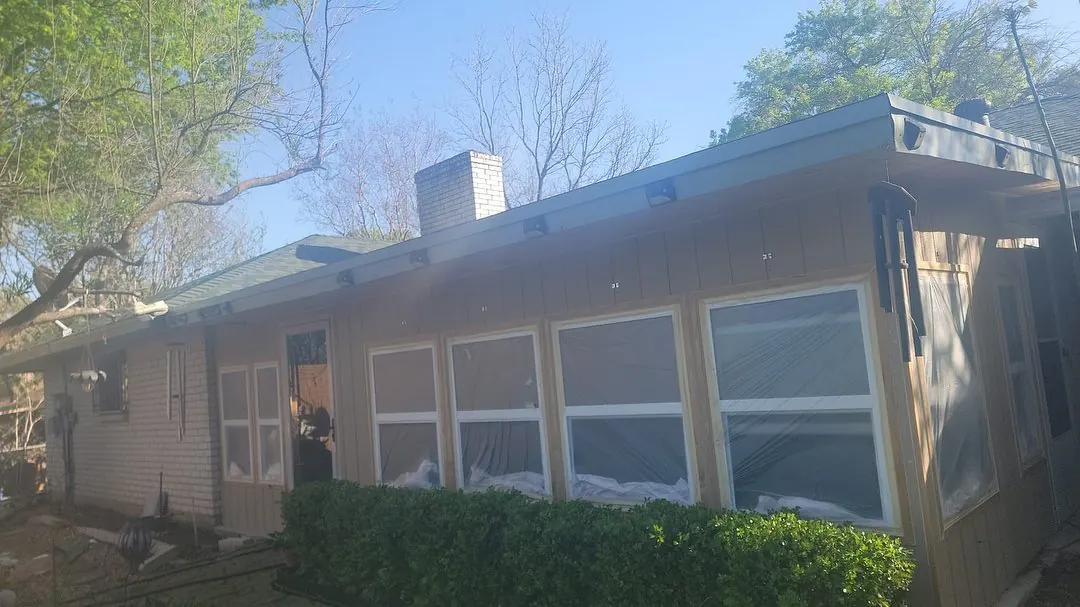 Single-story Austin-area home before exterior painting and masking